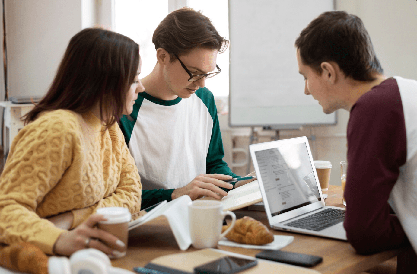 Group of high school students doing research with the help of AI